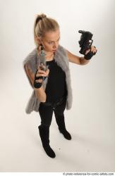 NIKOL STANDING POSE WITH TWO GUNS